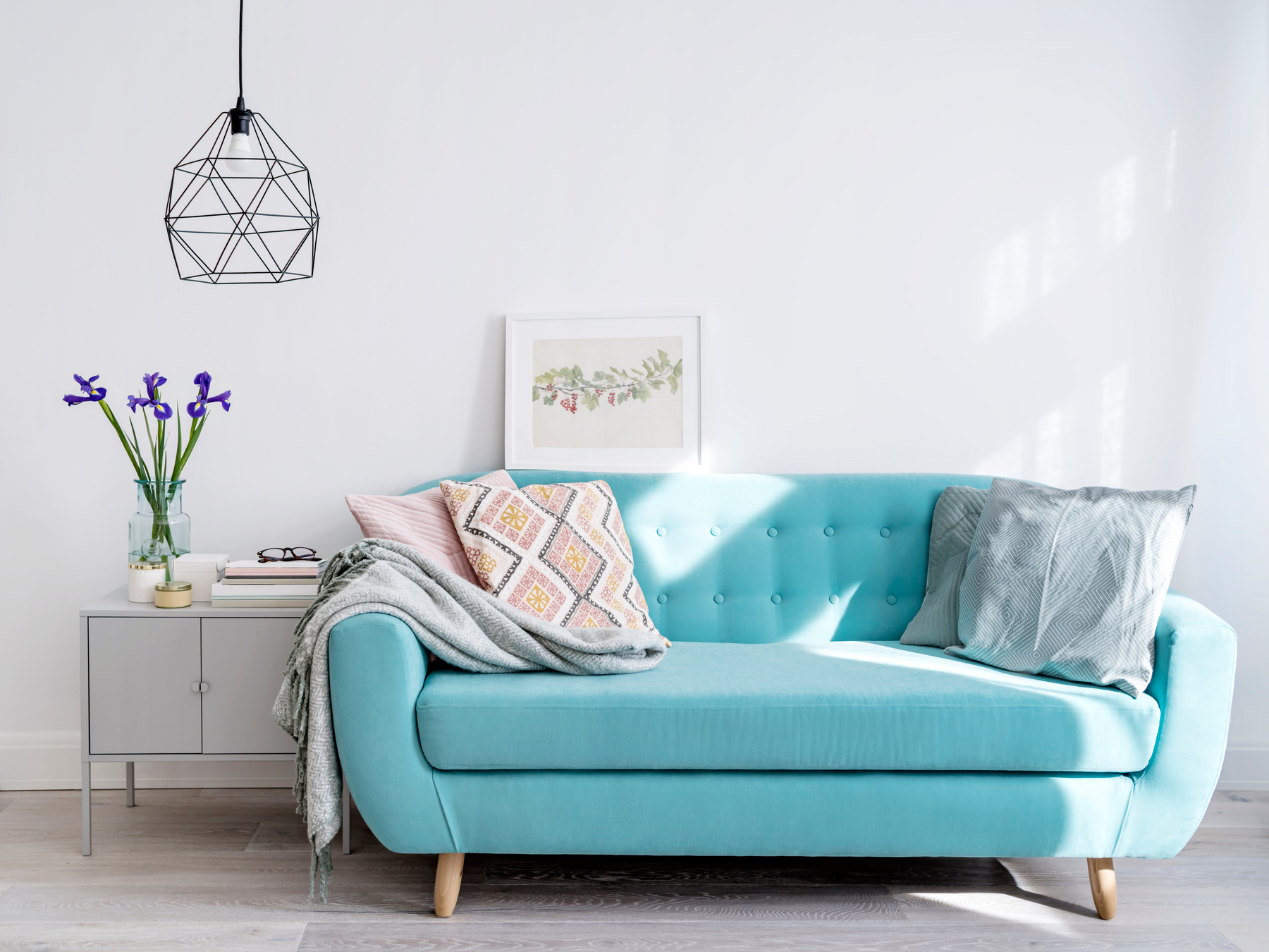 Bright blue sofa in stylish home interior